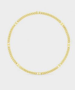 Gold chain necklace on white background.