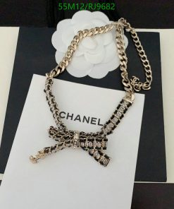 Chanel branded bow pendant with chain on display