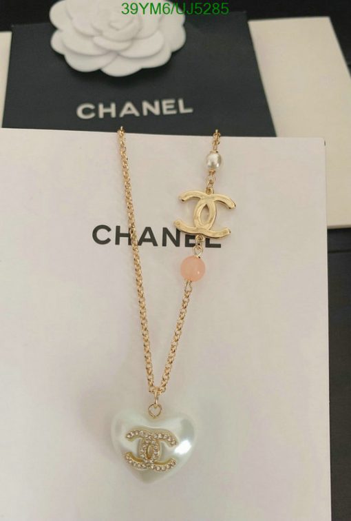 Chanel pearl and pendant necklace on display.