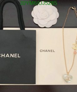 Chanel branded bags and necklace on display.