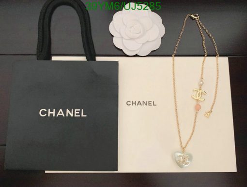 Chanel branded bags and necklace on display.