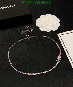 Chanel rhinestone necklace with box and flower decoration.