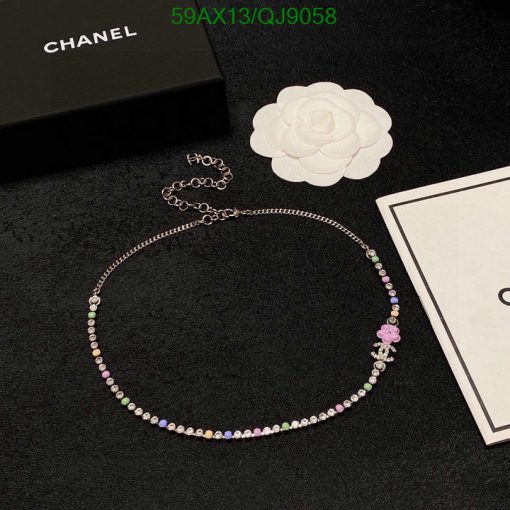 Chanel rhinestone necklace with box and flower decoration.