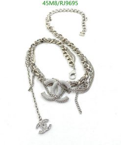 Silver necklace with intertwined chain design and pendant.