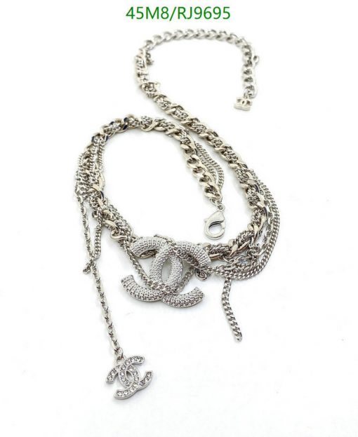 Silver necklace with intertwined chain design and pendant.