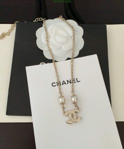 Designer necklace on branded display.