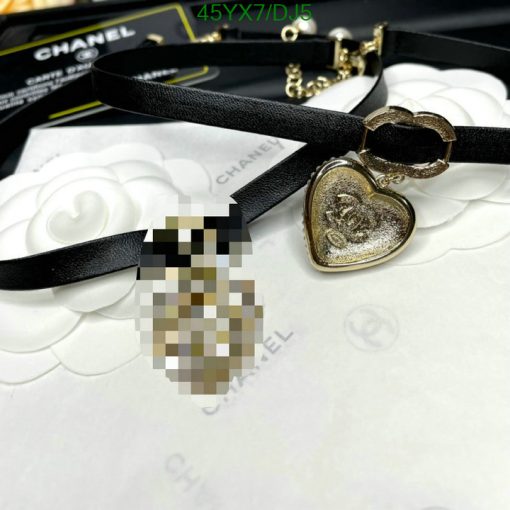 Chanel branded heart pendant and black leather necklace.