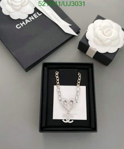 Chanel necklace with packaging on gray background