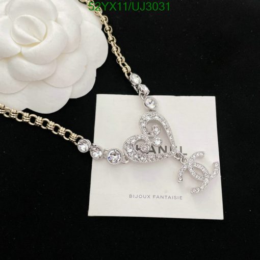 Elegant crystal heart bracelet with floral design.