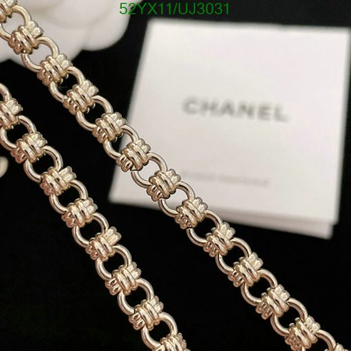 Chanel branded luxury silver chain bracelet close-up.