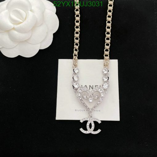 Elegant designer-inspired crystal pendant necklace on white background.