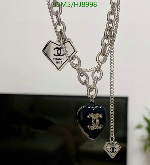 Designer silver chain necklace with logo pendants.