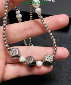 Silver dice and pearl necklace jewelry.