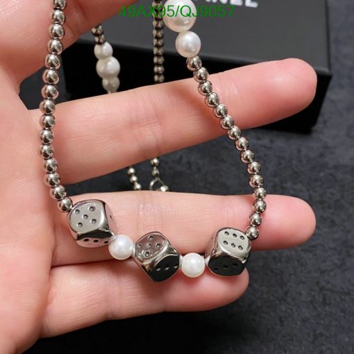 Silver dice and pearl necklace jewelry.