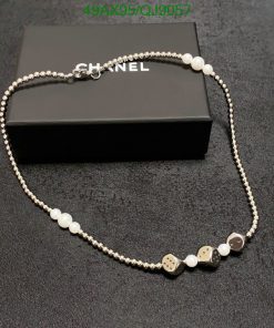 Elegant pearl and bead designer necklace on black box.