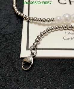 Silver bead necklace with lobster clasp and certificate.