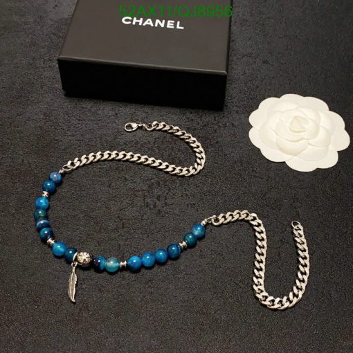 Blue beaded necklace with silver chain and packaging.