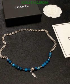 Chanel silver chain necklace with blue beads and charm.