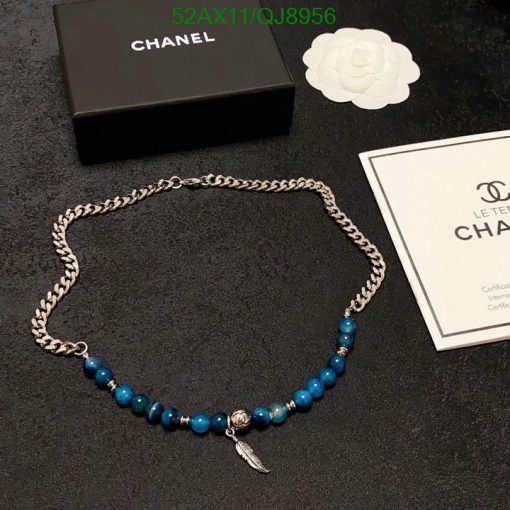 Chanel silver chain necklace with blue beads and charm.