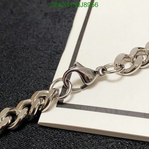 Silver chain bracelet on contrasting background.