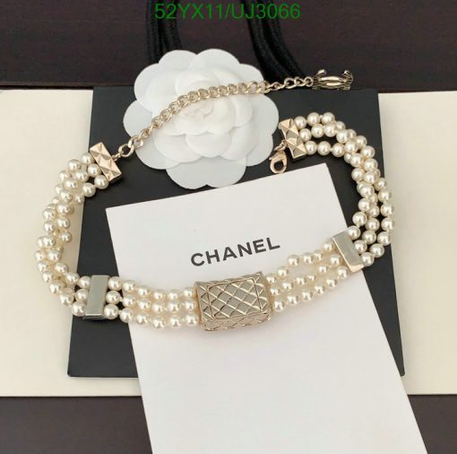 Elegant pearl designer bracelet on display with packaging.