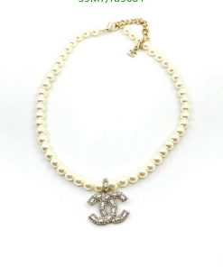 Pearl necklace with anchor pendant on white.