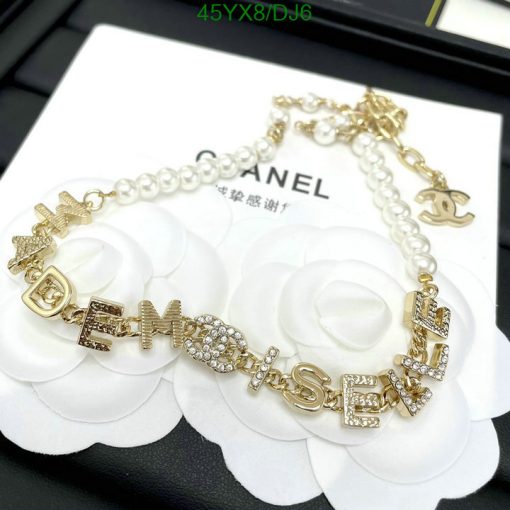 Pearl bracelet with gold-tone letter charms.