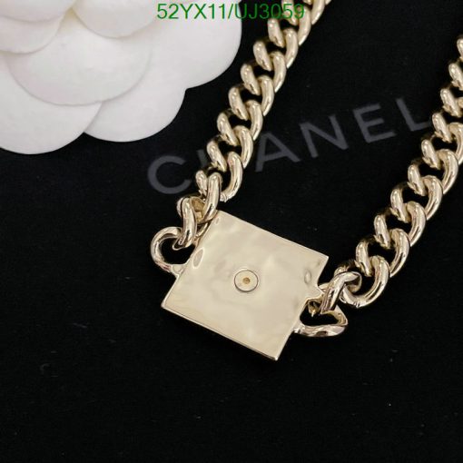 Gold chain necklace with designer clasp detail.