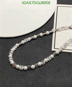 Pearl necklace with silver accents on display