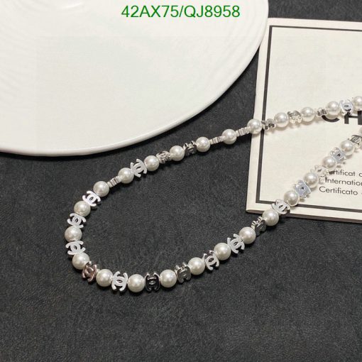 Pearl necklace with silver accents on display