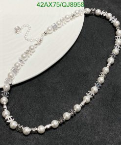 Elegant pearl necklace with silver accents on display.