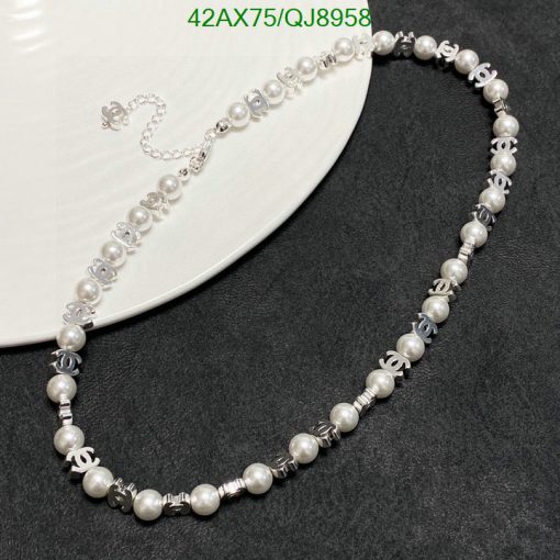 Elegant pearl necklace with silver accents on display.