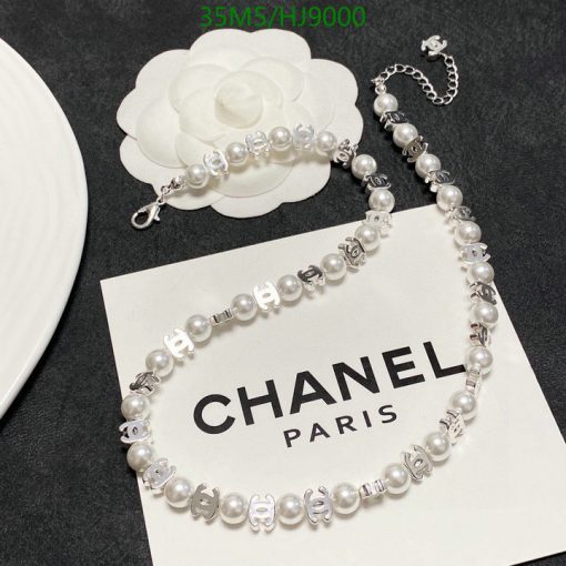 Pearl bracelet with logo charms on Chanel card.