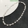 Pearl necklace with silver accents on white background.