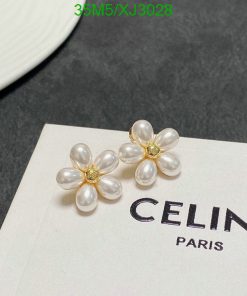 Pearl flower earrings on branded card.