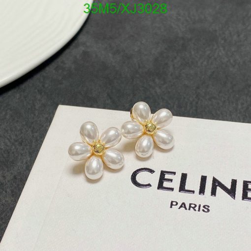 Pearl flower earrings on branded card.