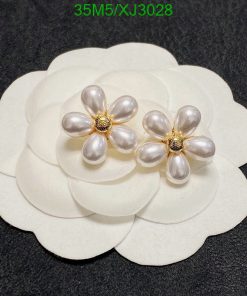 Pearl flower earrings on white display.