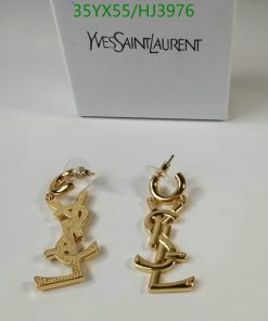 Yves Saint Laurent logo earrings on white background.