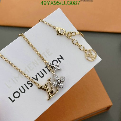 Designer logo chain bracelet on branded card.