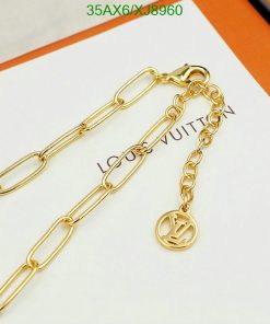 Gold chain with designer logo charm.