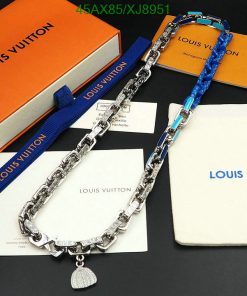 Louis Vuitton chains and box on display.