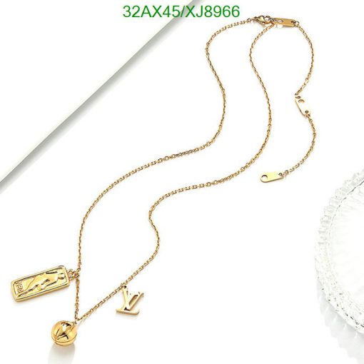 Gold charm bracelet with elegant design on white background.