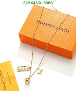 Designer necklace with pendant on branded orange box.