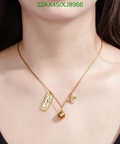 Gold pendant necklace on woman's neck