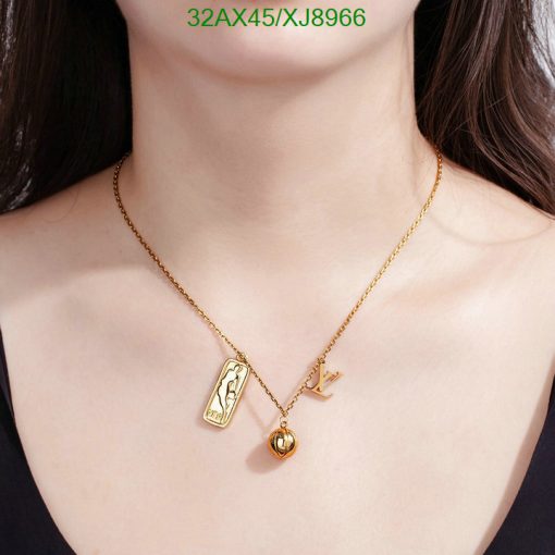 Gold pendant necklace on woman's neck