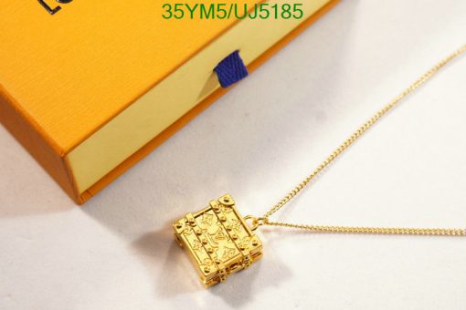 Gold book pendant on chain with luxury box.