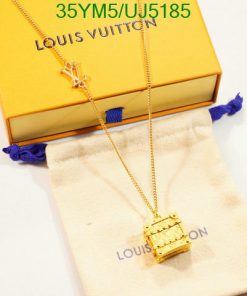 Louis Vuitton necklace and box on white surface.