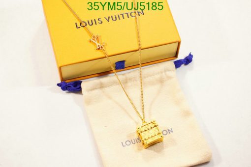 Louis Vuitton necklace and box on white surface.