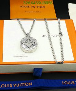 Silver pendant necklace on branded orange box display.