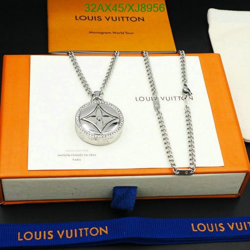 Silver pendant necklace on branded orange box display.